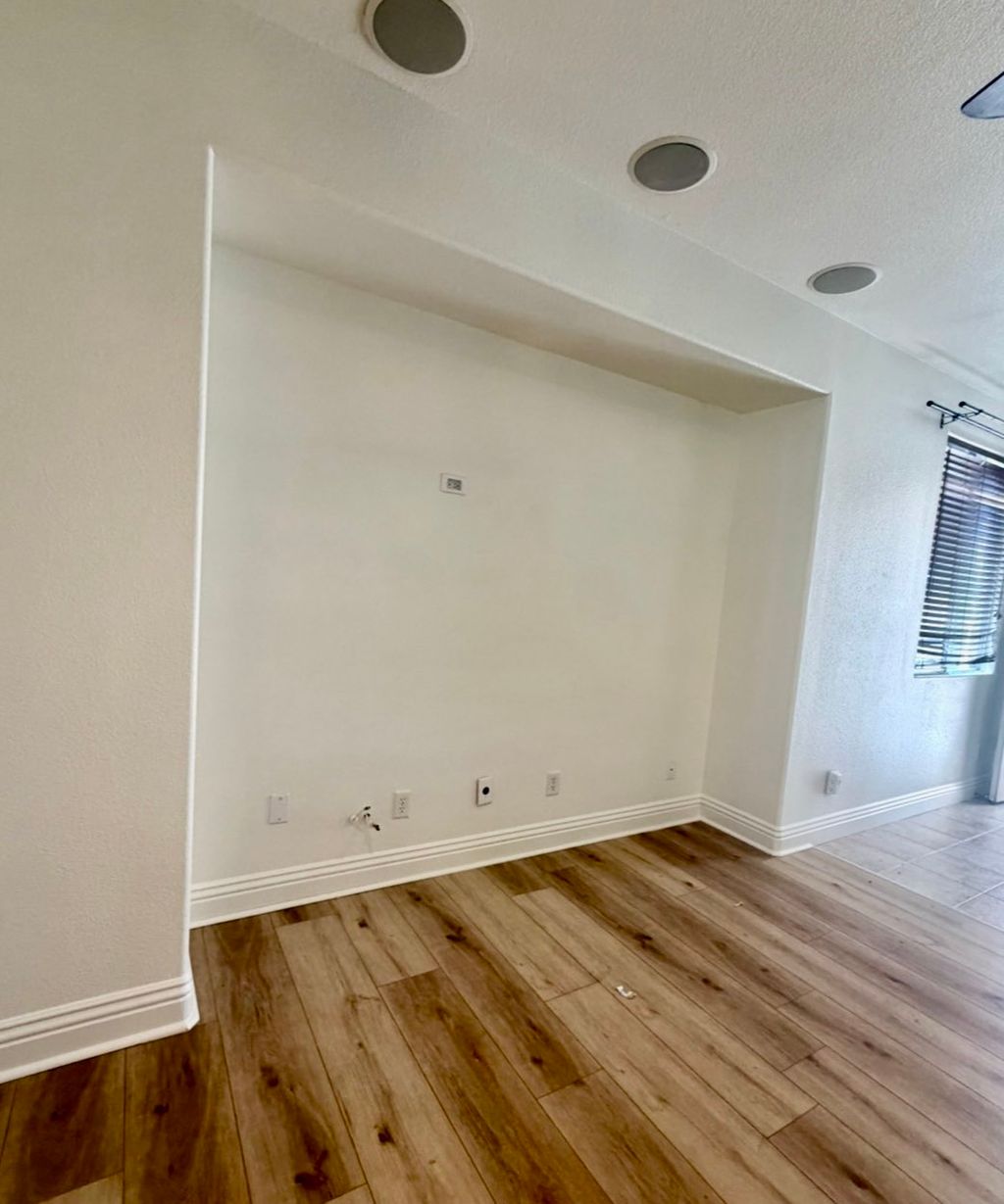 Living room repaint with clean white walls